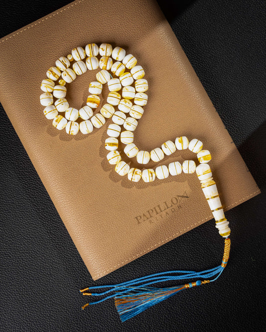 SUBHA made of honey-colored mastic with a decorative tassel pendant