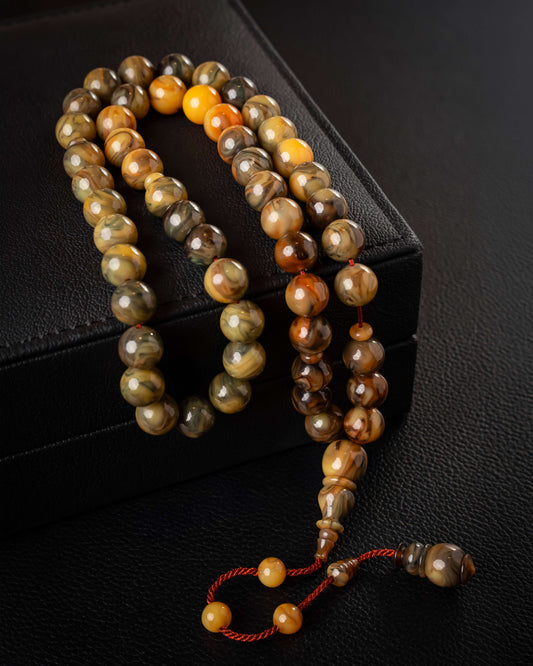 Multicolored Faturan Subha with drilled bead design, 53 beads.