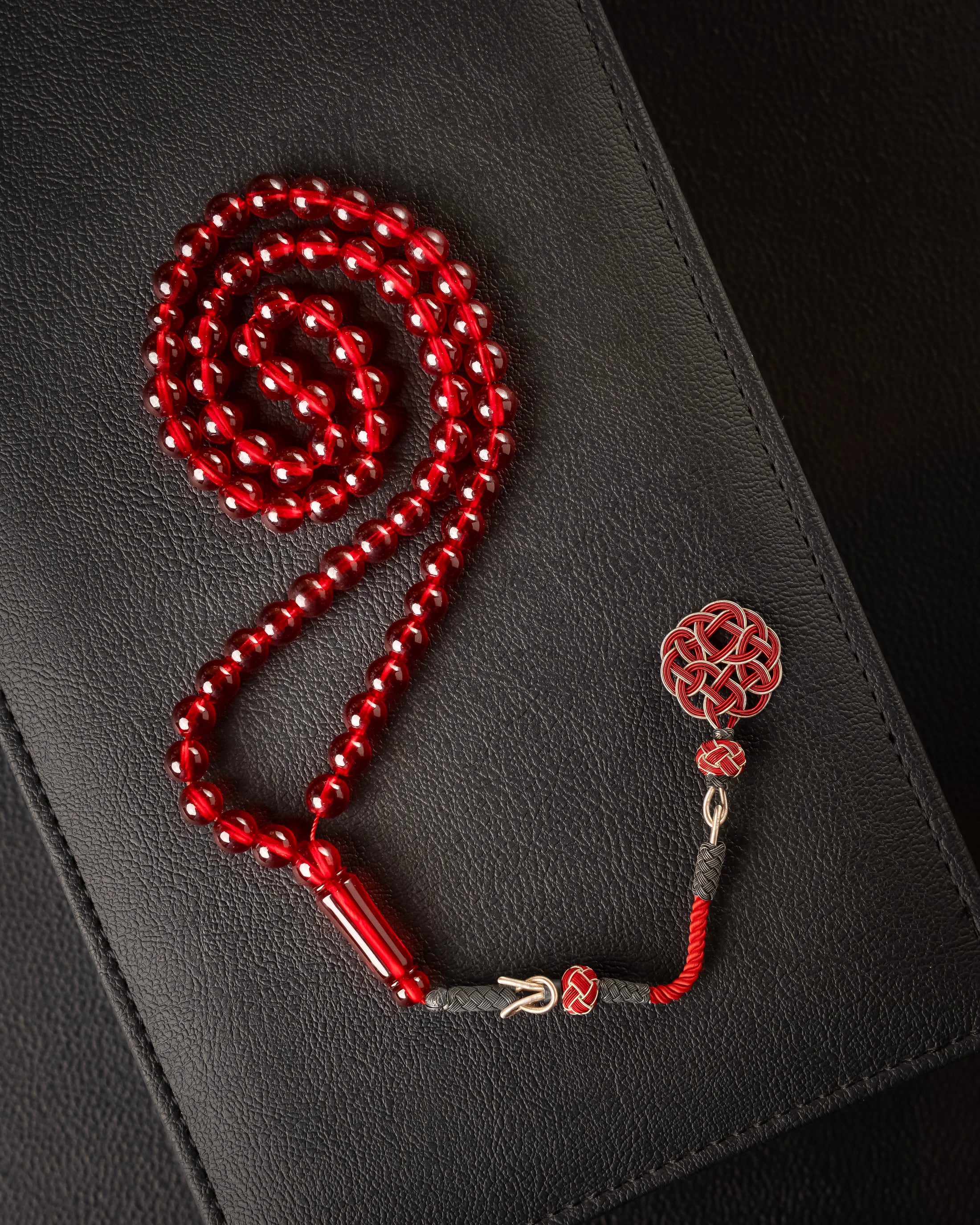 Saffron-scented Subha with a silver tassel charm