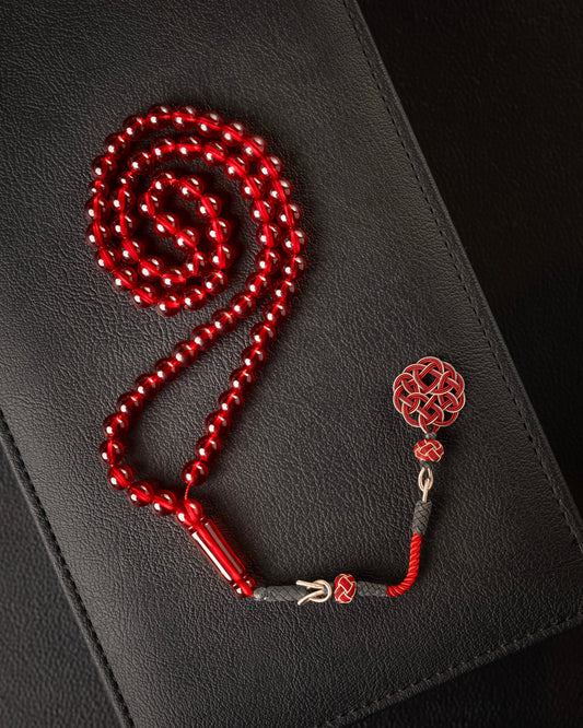 Saffron-scented Subha with a silver tassel charm