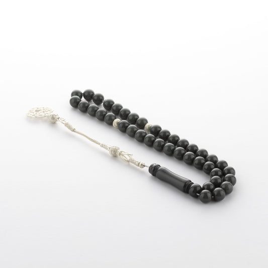 كهرمان سبها الأسود العاجي المنحوت